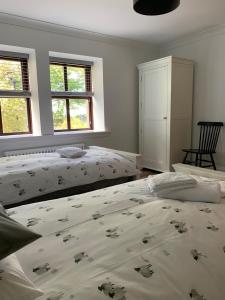 A bed or beds in a room at Crawfield Grange