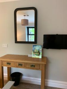A television and/or entertainment center at Crawfield Grange 