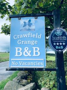a sign for a cranfield grange bar and no vacancies at Crawfield Grange in Stonehaven
