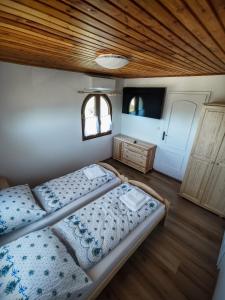Uma cama ou camas num quarto em U Matůšků