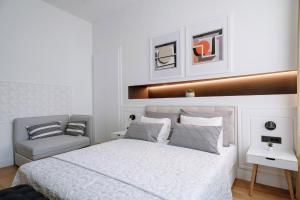 Postel nebo postele na pokoji v ubytování THE City Lodge - Boutique Apartments