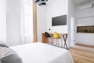 Postel nebo postele na pokoji v ubytování THE City Lodge - Boutique Apartments