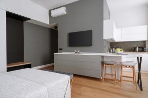 Kuchyň nebo kuchyňský kout v ubytování THE City Lodge - Boutique Apartments