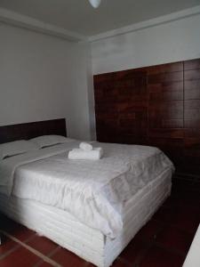 A bed or beds in a room at Nova Aldeia Buzios