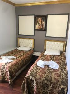 Postel nebo postele na pokoji v ubytování Meddusa Hotel
