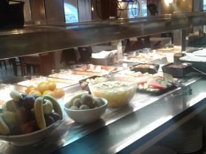 a buffet line with many different types of food at Hotel Roca Bella in Es Pujols