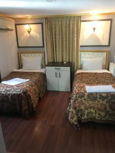 Postel nebo postele na pokoji v ubytování Meddusa Hotel