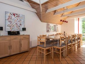 A restaurant or other place to eat at 16 person holiday home in Ulfborg