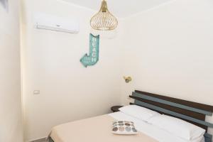 Postel nebo postele na pokoji v ubytování Don Ferdinando