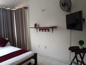 A bed or beds in a room at Hotel Don Juan Colonial