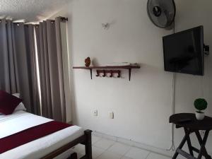TV a/nebo společenská místnost v ubytování Hotel Don Juan Colonial