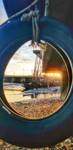 a view of a reflection of a beach in a tire at Buorana in Chon Buri