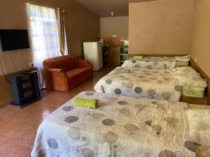 Postel nebo postele na pokoji v ubytování Hotel Uran
