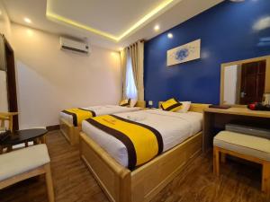 Postel nebo postele na pokoji v ubytování Hoàng Gia Hotel Côn Đảo