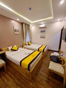 Postel nebo postele na pokoji v ubytování Hoàng Gia Hotel Côn Đảo