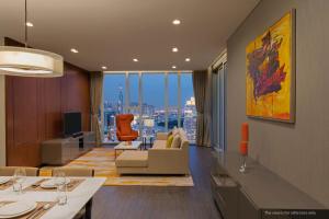 a living room with a view of a city at Sedona Suites Ho Chi Minh City in Ho Chi Minh City