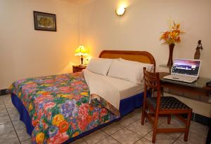 Postel nebo postele na pokoji v ubytování Hotel Club del Sol