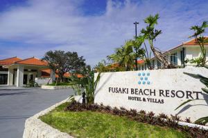 a sign for the flush beach resort in front of a building at FUSAKI BEACH RESORT HOTEL & VILLAS in Ishigaki Island