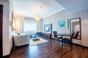 Postel nebo postele na pokoji v ubytování First Central Hotel Suites