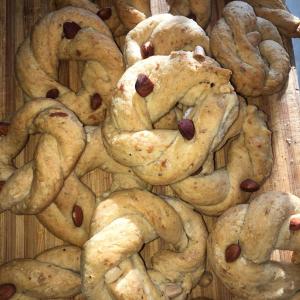 a pile of cookies with nuts on a wooden table at la masseria di Antonio e Teresina in Colli al Volturno