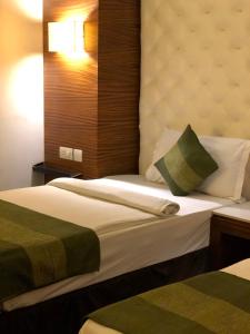 Postel nebo postele na pokoji v ubytování Hotel Ivory 32