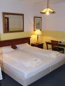 Cama ou camas em um quarto em Hotel-Restaurant Orsoyer Hof