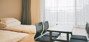 The N Resort Hotel&Spa YangYang客房内的一张或多张床位