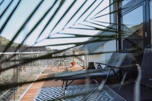 a view of a balcony with a chair on a deck at Modern Loft/Apartment near Bonn DTAG/DHL/UN in Königswinter