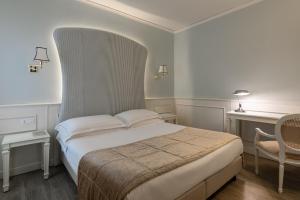 Letto o letti in una camera di Hotel San Luca