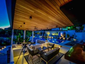 an outdoor living room with a view of a pool at Apartments Secret Garden in Ulcinj