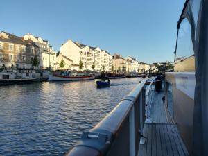 a view of a river with boats and buildings at Maz glaz in Nantes