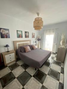 Ένα ή περισσότερα κρεβάτια σε δωμάτιο στο Piso en Conil con Vistas al mar