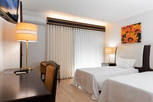 Postel nebo postele na pokoji v ubytování Hotel Jardim