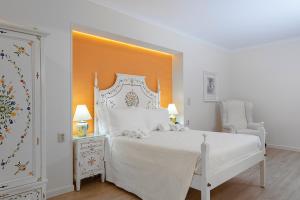Postel nebo postele na pokoji v ubytování Hotel Jardim