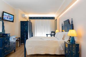 Postel nebo postele na pokoji v ubytování Hotel Jardim