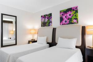 Postel nebo postele na pokoji v ubytování Hotel Jardim