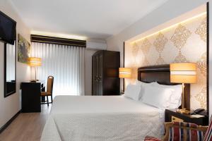 Postel nebo postele na pokoji v ubytování Hotel Jardim