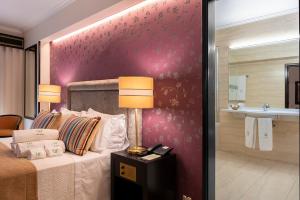 Postel nebo postele na pokoji v ubytování Hotel Jardim
