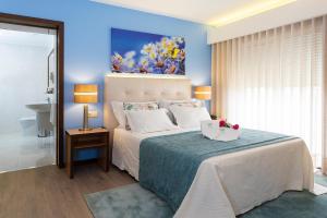 Postel nebo postele na pokoji v ubytování Hotel Jardim
