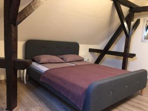 A bed or beds in a room at Battonya House