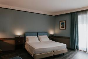 Postel nebo postele na pokoji v ubytování Hotel Del Campo