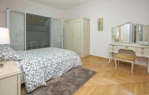 a bedroom with a bed and a desk and a mirror at Omirou “Best Kept Secret” in Athens