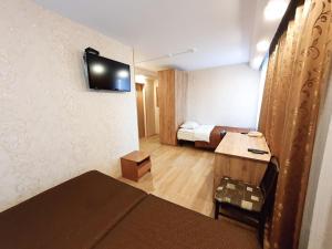 Ein Bett oder Betten in einem Zimmer der Unterkunft Kievskaya Hotel on Kurskaya