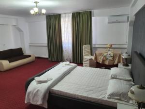 Postel nebo postele na pokoji v ubytování BON TON Residence
