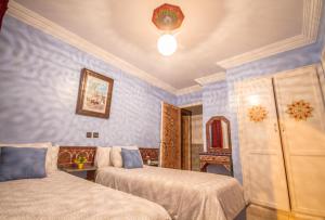 Rúm í herbergi á Hotel Tarek