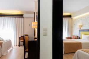 Postel nebo postele na pokoji v ubytování Hotel Jardim