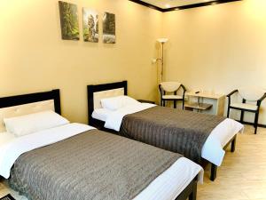 Ein Bett oder Betten in einem Zimmer der Unterkunft Hotel-Restaurant Complex Relax