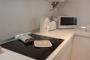 Kuchyňa alebo kuchynka v ubytovaní Domus Suites Verona