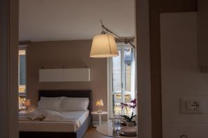 Posteľ alebo postele v izbe v ubytovaní Domus Suites Verona