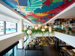a view of the lobby of a building with a colorful ceiling at citizenM Kuala Lumpur Bukit Bintang in Kuala Lumpur
